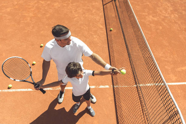 istock Family learning to play tennis 862701076