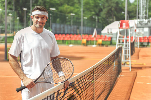 istock Cheerful coach going to play tennis 862704136