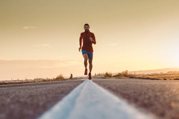 istock Man running on a paved road 862704316