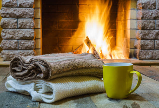 istock Mug  for tea or coffee,  wool things near  cozy fireplace. 862704732
