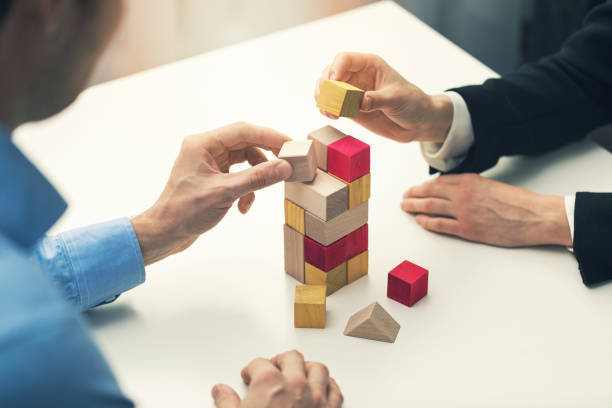 business cooperation and partnership concept - businessmen working together