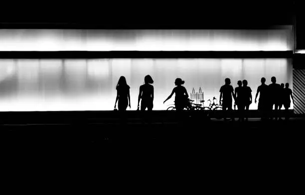 Photo of Silhouettes of young people in the night