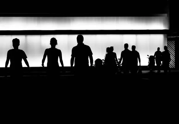 Photo of Silhouettes of people in the night