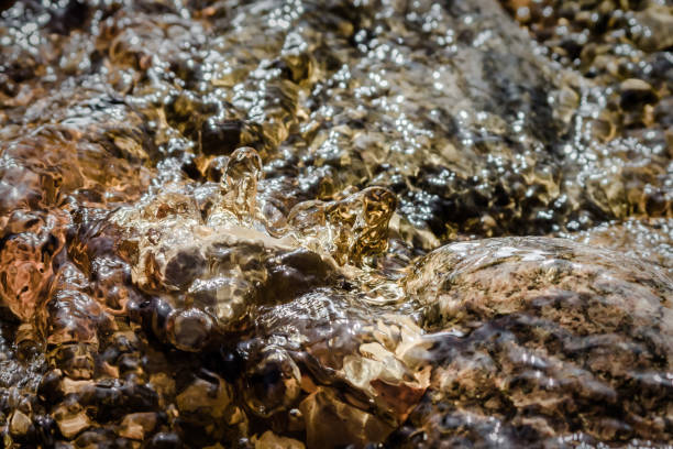 istock Close up water creek  floating over stones 862707380
