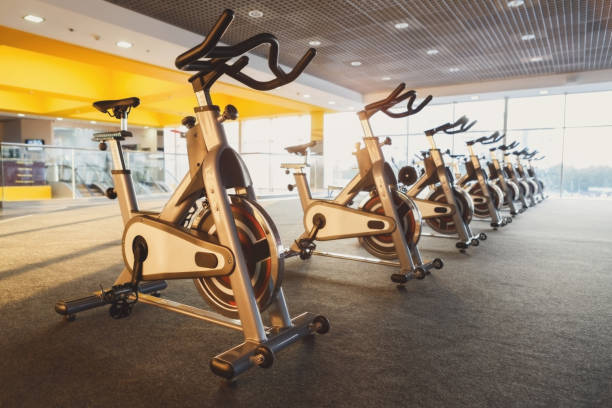 istock Modern gym interior with equipment, fitness exercise bikes 862715250