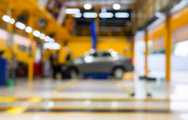 istock Blurred scene of car garage with maintenance and fixing 862715454