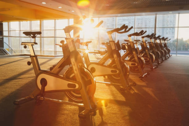 istock Modern gym interior with equipment, fitness exercise bikes 862715566