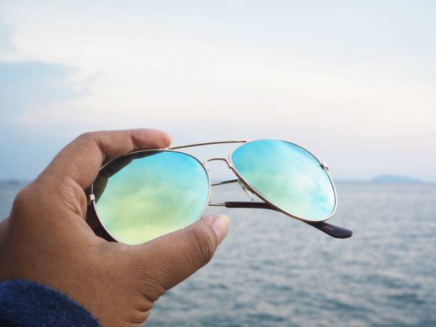 istock Selfie of sun glasses on hand with beach 862716814