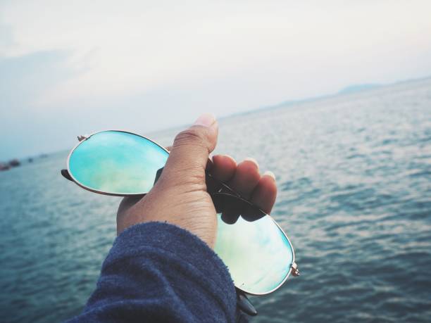 istock Selfie of sun glasses on hand with beach 862717096