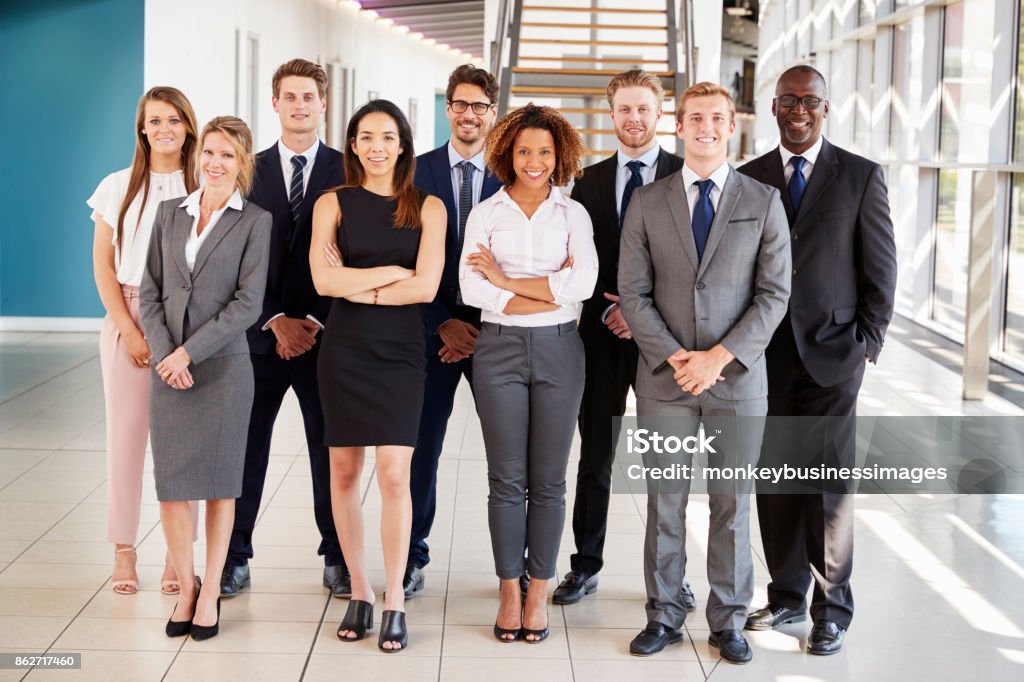Office workers in a modern lobby, full length group portrait Professional Occupation Stock Photo