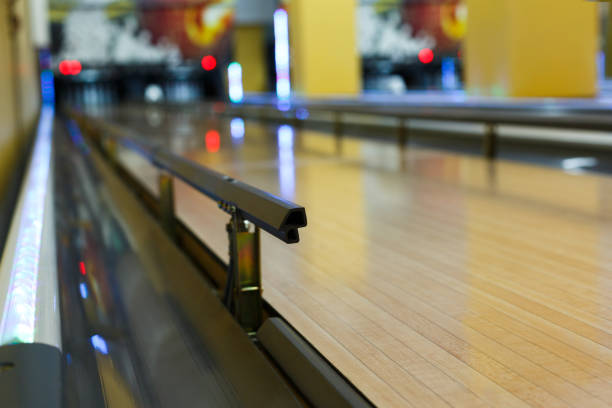 Bowling alley background, lane with bumper rails Bowling alley background. Lane with bumper rails closeup. Leisure activity club bumper stock pictures, royalty-free photos & images
