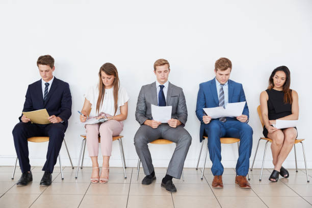 istock Candidates waiting for job interviews, full length, front 862718202