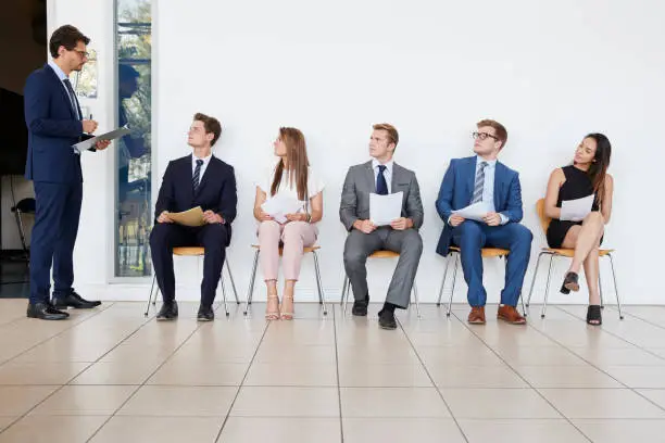 Photo of Recruiter and people waiting for job interviews, full length