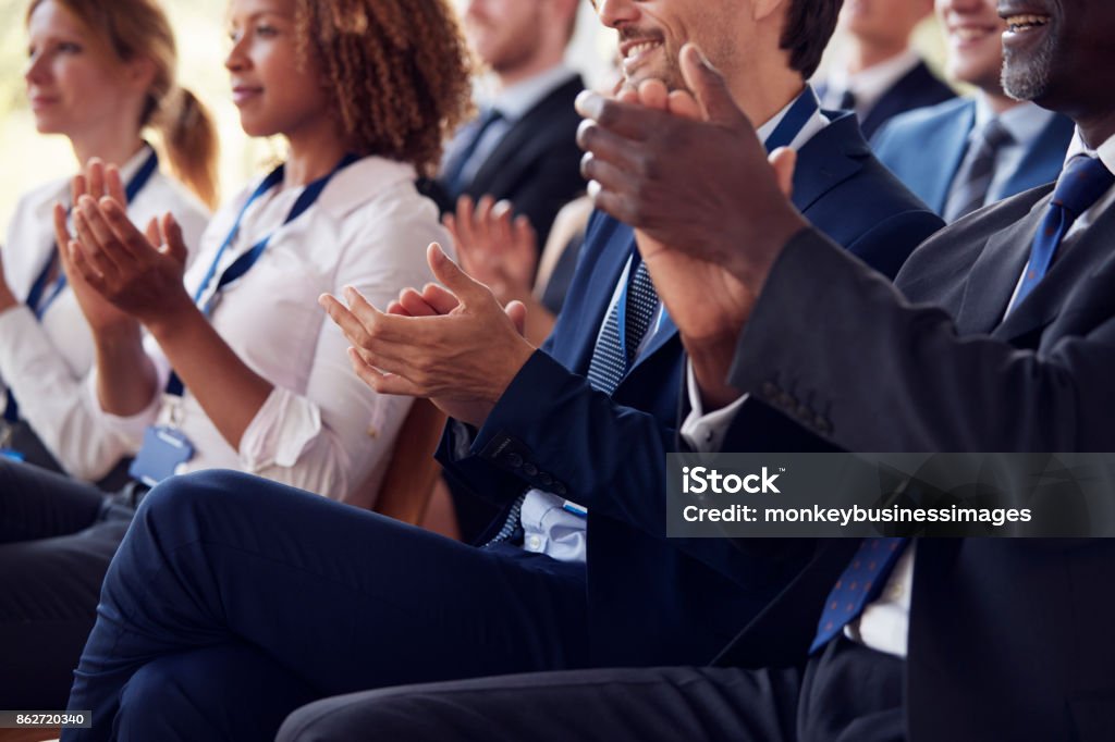 Mid section of applauding audience at business seminar Business Stock Photo