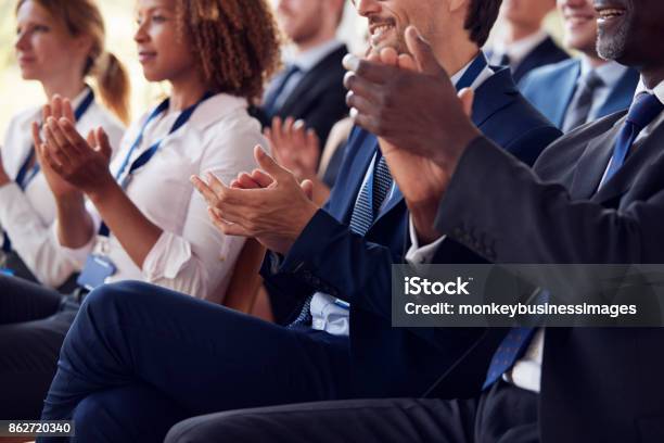 Mid Section Of Applauding Audience At Business Seminar Stock Photo - Download Image Now