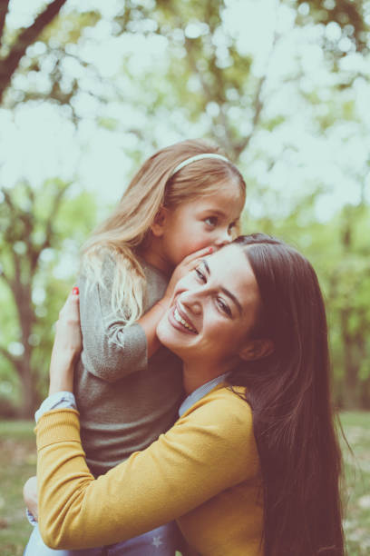 istock Mother and daughter in city park. Front view. 862720788