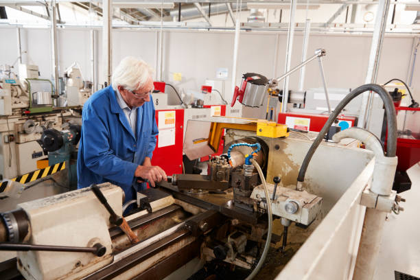 istock Senior engineer operating industrial machinery in a factory 862720858