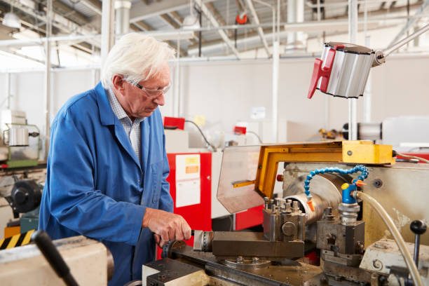 istock Senior engineer working in a factory, close up 862720950
