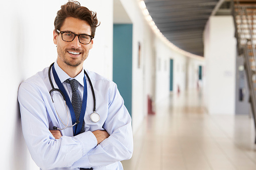 Portrait of young male doctor with stethoscope, close up