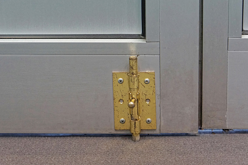 Latch lock at bottom of aluminum door