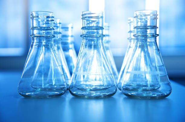 istock blue clear glass flask in medical science laboratory background 862728894