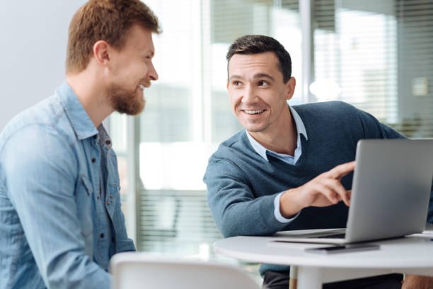 istock Smiling brunette talking to his new colleague 862729138