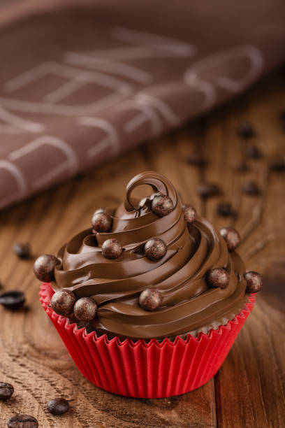 istock Homemade coffee and chocolate cupcake in red cup 862732672