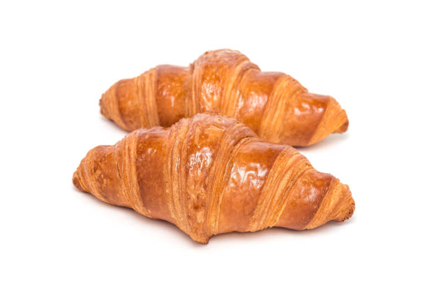 istock Two fresh croissant isolated on white background, 862739042