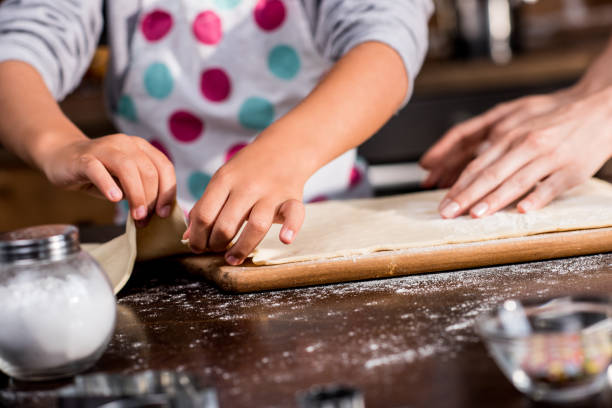 istock family cooking at home 862739044