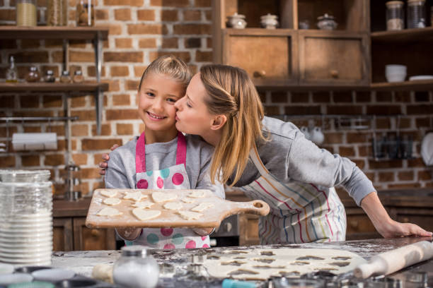 istock child holding cookies on cutting board 862739382
