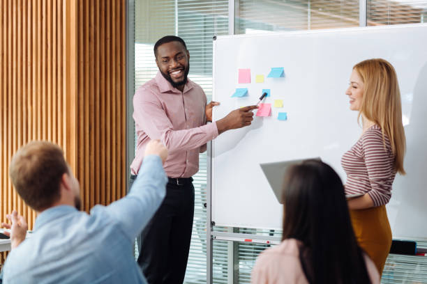 istock Attractive man pointing at colorful sticker 862739960