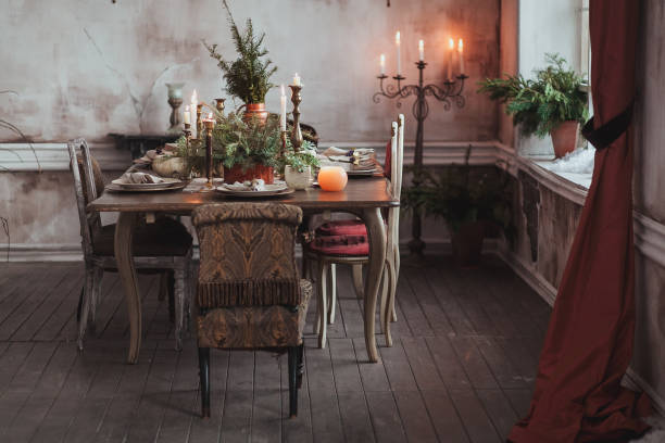 istock Christmas table setting. Vintage chairs, natural pine tree branches, candles. Rural or rustic style decorations 862740014