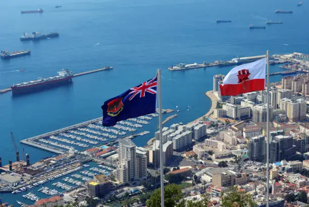 Photo of Gibraltar - flags of Gibraltar and the town