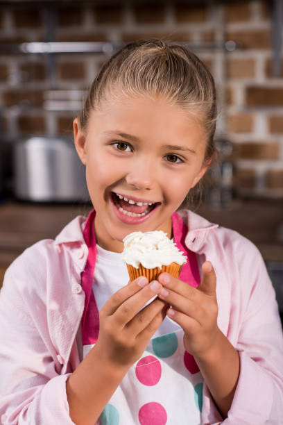 istock child with sweet cupcake 862740696