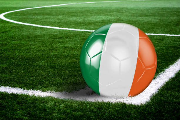 Irish Soccer Ball on Field at Night High quality render of soccer ball ready to shoot at at soccer field on green grasses. 3D rendering. football field night american culture empty stock pictures, royalty-free photos & images
