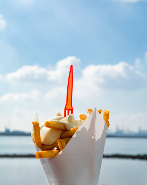 istock Dutch french fries from mashed potato with mayonaise and plastic fork on top 862741696