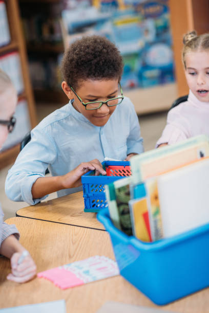 istock kids choosing supplies in box 862741830