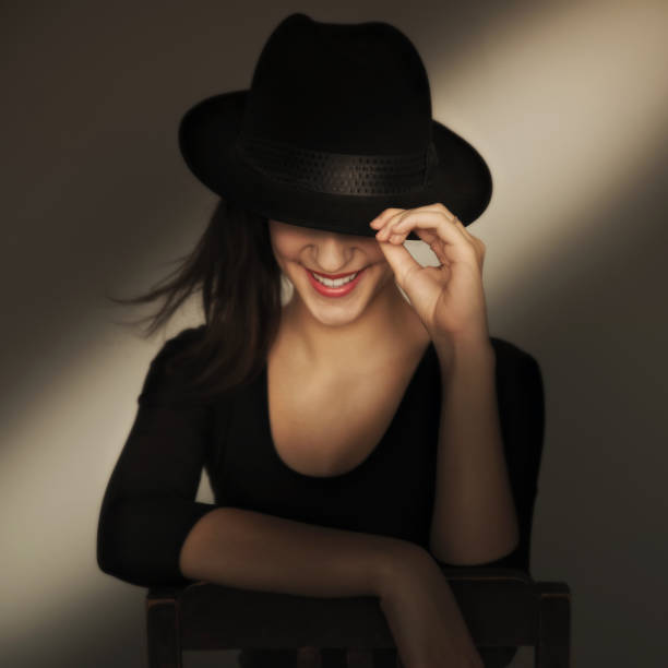 Woman reading a magazine in hotel room