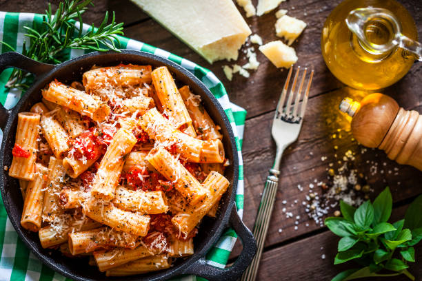 istock Pasta in a cast iron pan shot from above on rustic wooden table 862745660