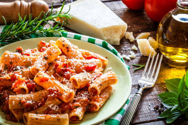 istock Pasta plate shot on rustic wooden table 862745762
