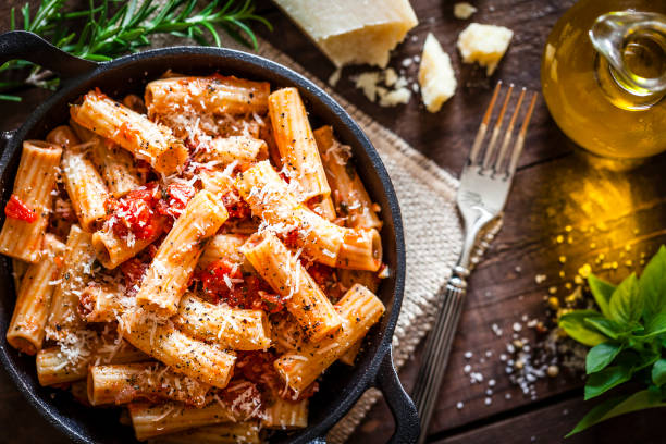istock Pasta in a cast iron pan shot from above on rustic wooden table 862745766