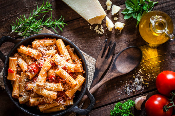 istock Pasta in a cast iron pan shot from above on rustic wooden table 862746038