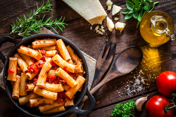 istock Pasta in a cast iron pan shot from above on rustic wooden table 862749998