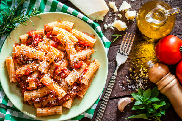 istock Pasta plate shot from above on rustic wooden table 862750314