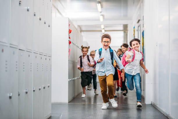 pupils running through school corridor cute funny pupils running through school corridor back to school stock pictures, royalty-free photos & images