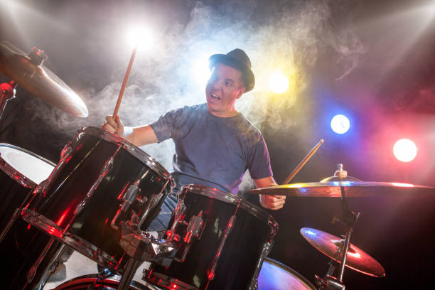 istock male musician with drumsticks playing drums 862754780