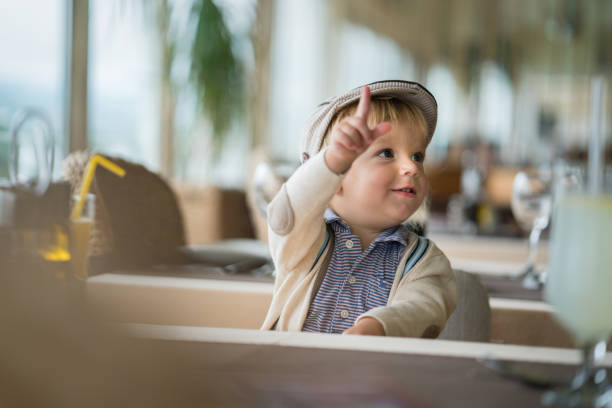young happy boy in the restaurant