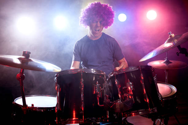 istock male musician with drumsticks playing drums 862769936