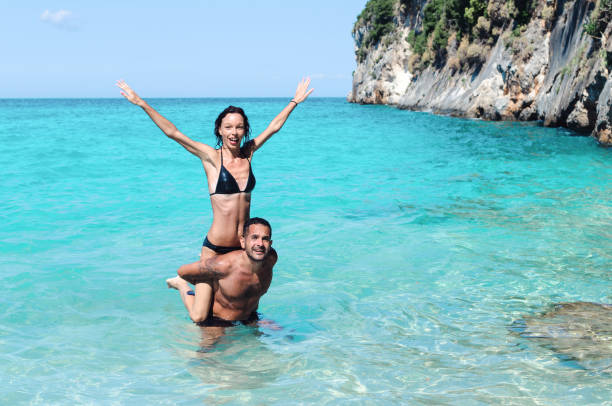 istock Man carry woman on his back 862774222