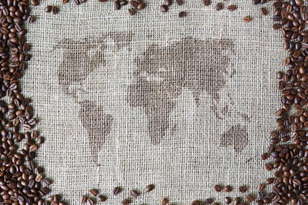 istock Burlap texture with coffee beans border and world map 862777624